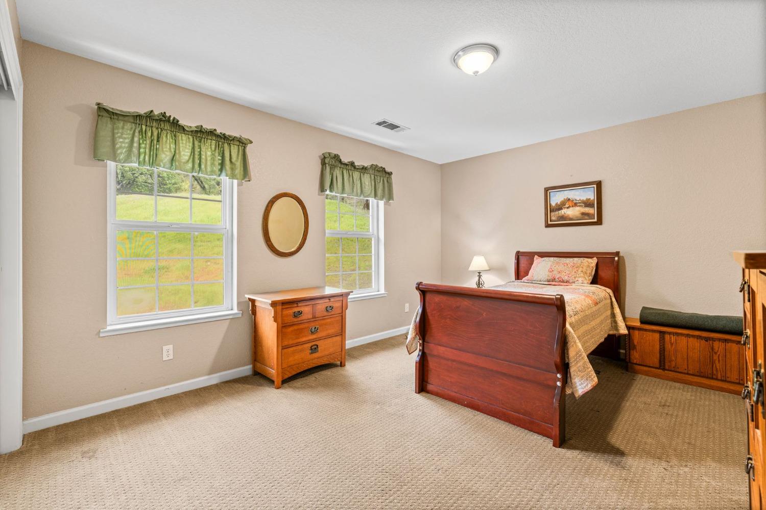 6432 Happy Valley Road Somerset, CA 95684 - Photo 10 of 90 a bedroom with a bed and a window