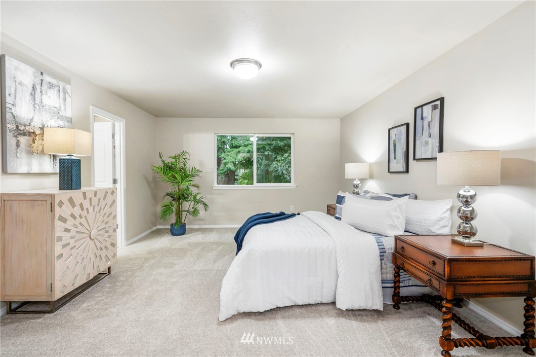 6719 Southeast 5th Street Renton, WA 98059 - Photo 14 of 29 a bedroom with a bed and a chair