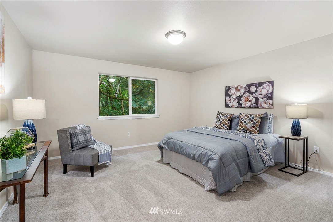 6719 Southeast 5th Street Renton, WA 98059 - Photo 22 of 29 a bedroom with a bed and a couch