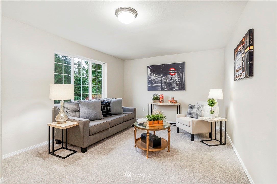 6719 Southeast 5th Street Renton, WA 98059 - Photo 24 of 29 a living room with furniture and a window