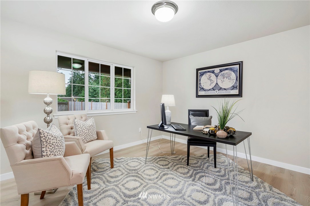 6719 Southeast 5th Street Renton, WA 98059 - Photo 4 of 29 a living room with furniture and a window