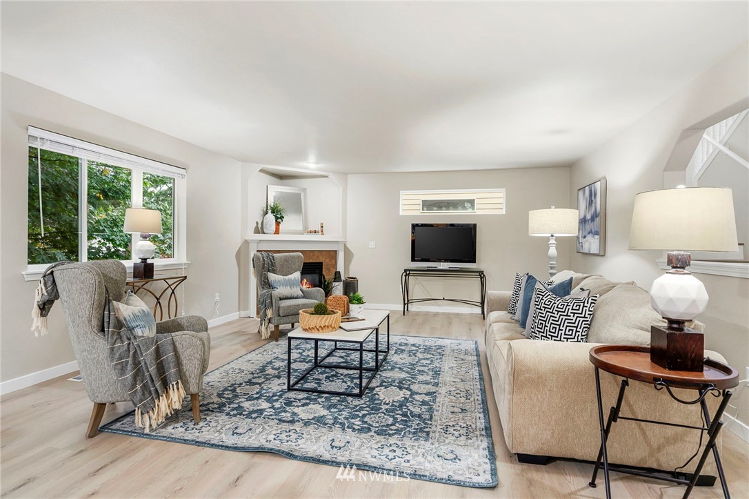 6719 Southeast 5th Street Renton, WA 98059 - Photo 5 of 29 a living room with furniture and a rug
