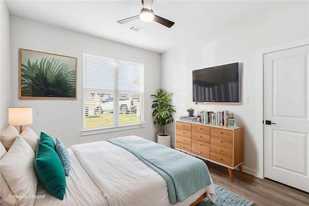 2102 Joppi Court Bryan, TX 77807 - Photo 24 of 27 a bedroom with a bed and a flat screen tv