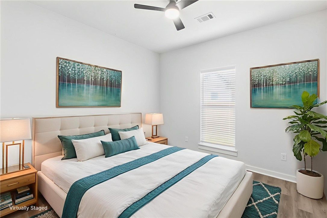 2102 Joppi Court Bryan, TX 77807 - Photo 26 of 27 a bedroom with bed and a window