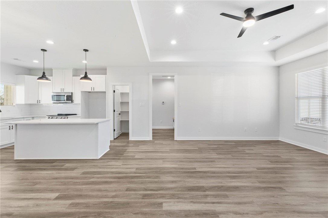 2102 Joppi Court Bryan, TX 77807 - Photo 8 of 27 an empty room with wooden floor and windows