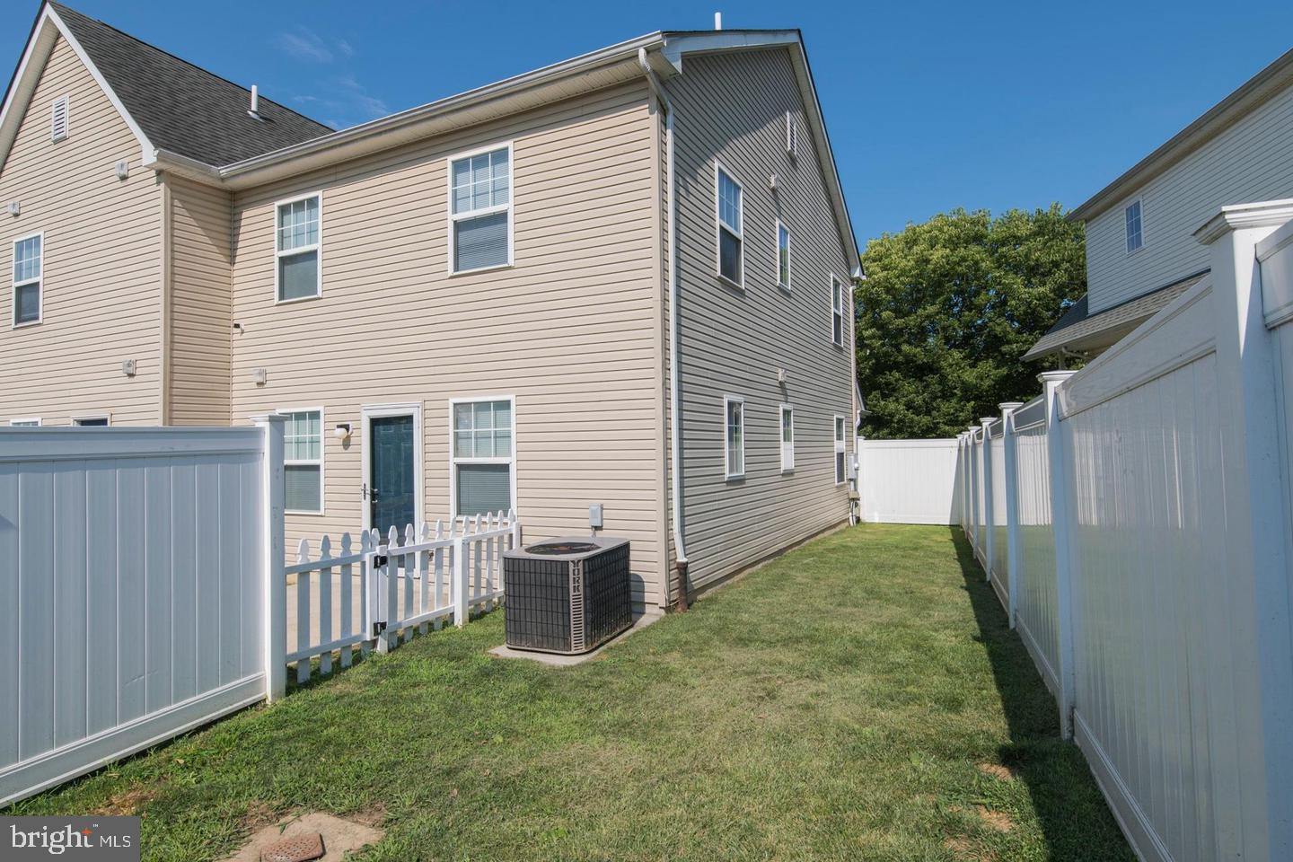 3718 Merrick Road Philadelphia, PA 19129 - Photo 8 of 30 a view of backyard of house with wooden fence