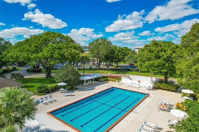 a view of a swimming pool with a patio