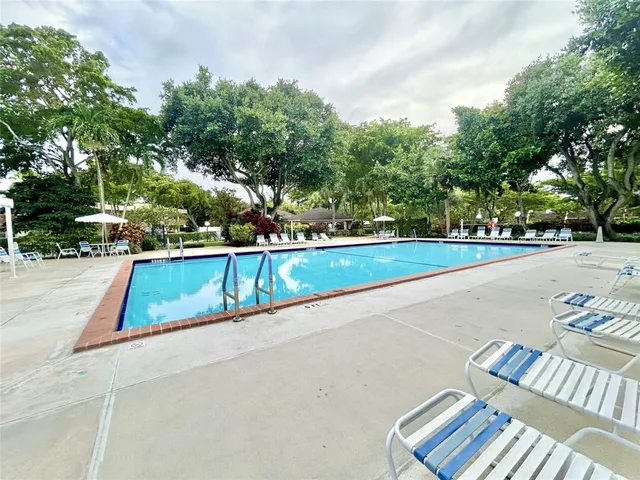 a view of swimming pool with patio
