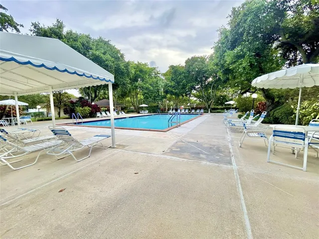 a view of a house with a small yard and plants