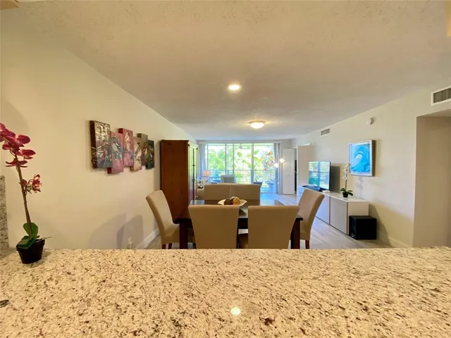 a bed room with a bed and large windows