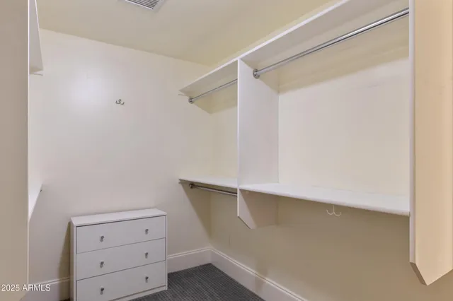 a view of an empty walk in closet
