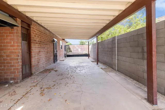 a view of backyard with patio