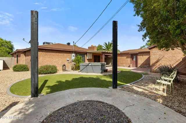 a view of a house with a porch and furniture