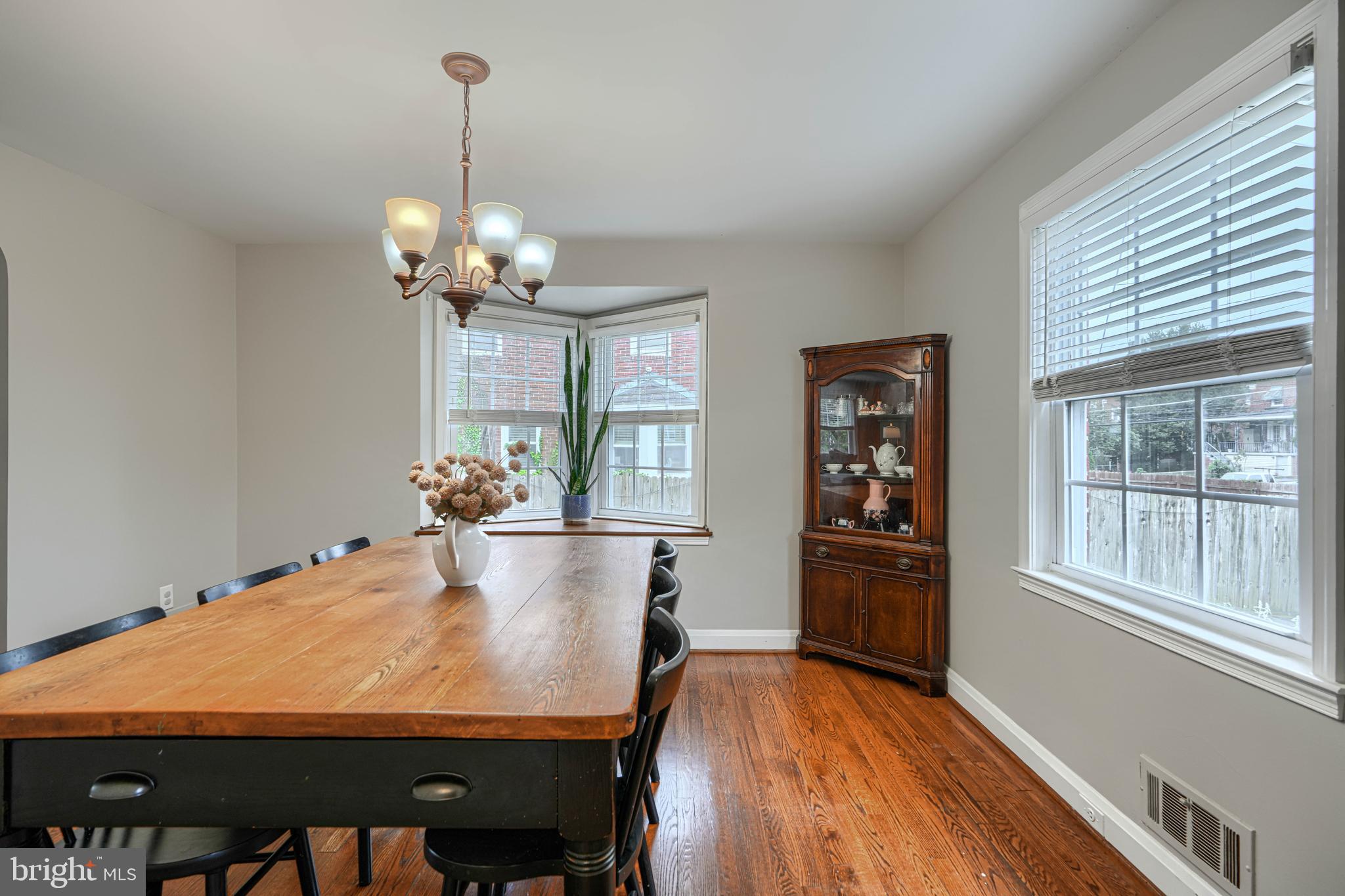 8132 Pleasant Plains Road Towson, MD 21286 - Photo 13 of 55 a view of a dining room with furniture window and wooden floor