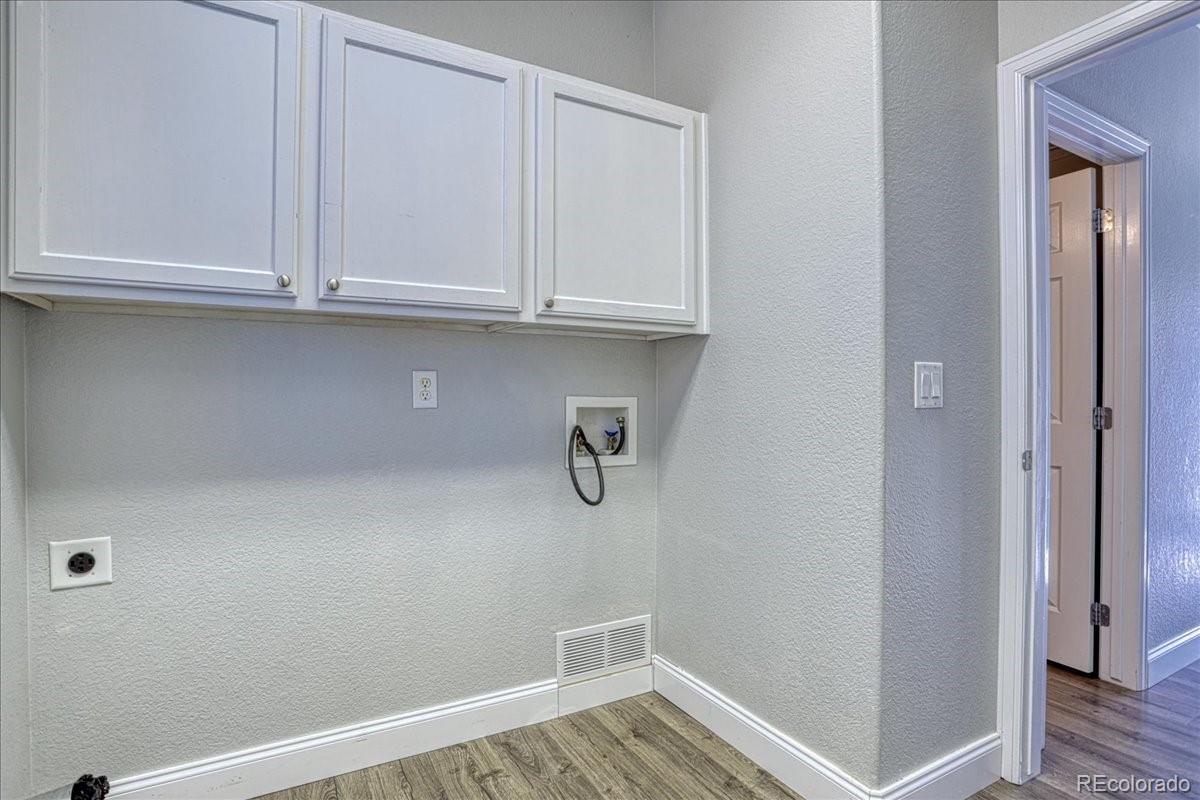 4005 Blue Pine Circle Highlands Ranch, CO 80126 - Photo 11 of 27 a view of kitchen with white cabinets