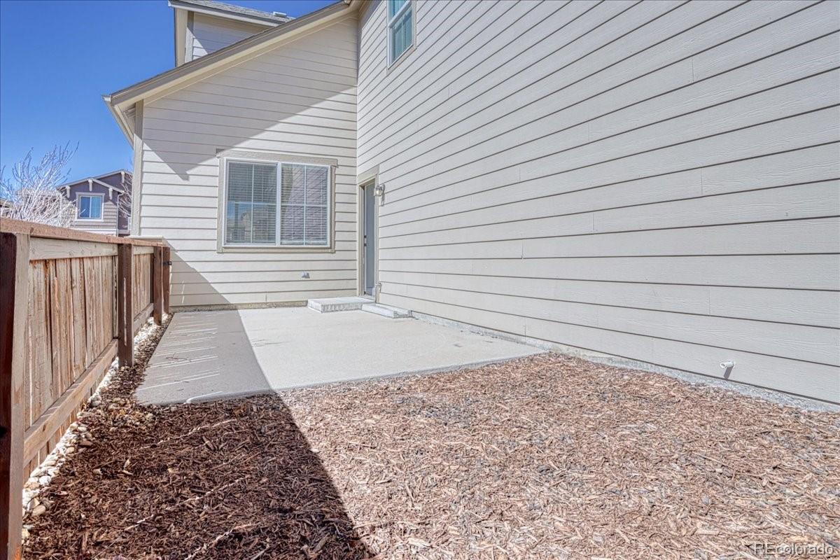 4005 Blue Pine Circle Highlands Ranch, CO 80126 - Photo 13 of 27 a view of a backyard with side of a house