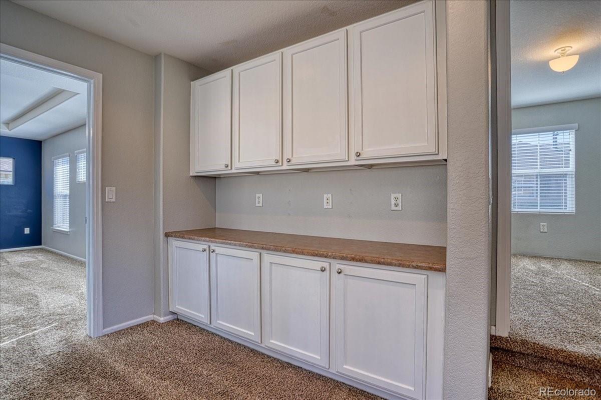 4005 Blue Pine Circle Highlands Ranch, CO 80126 - Photo 14 of 27 a view of cabinets and window
