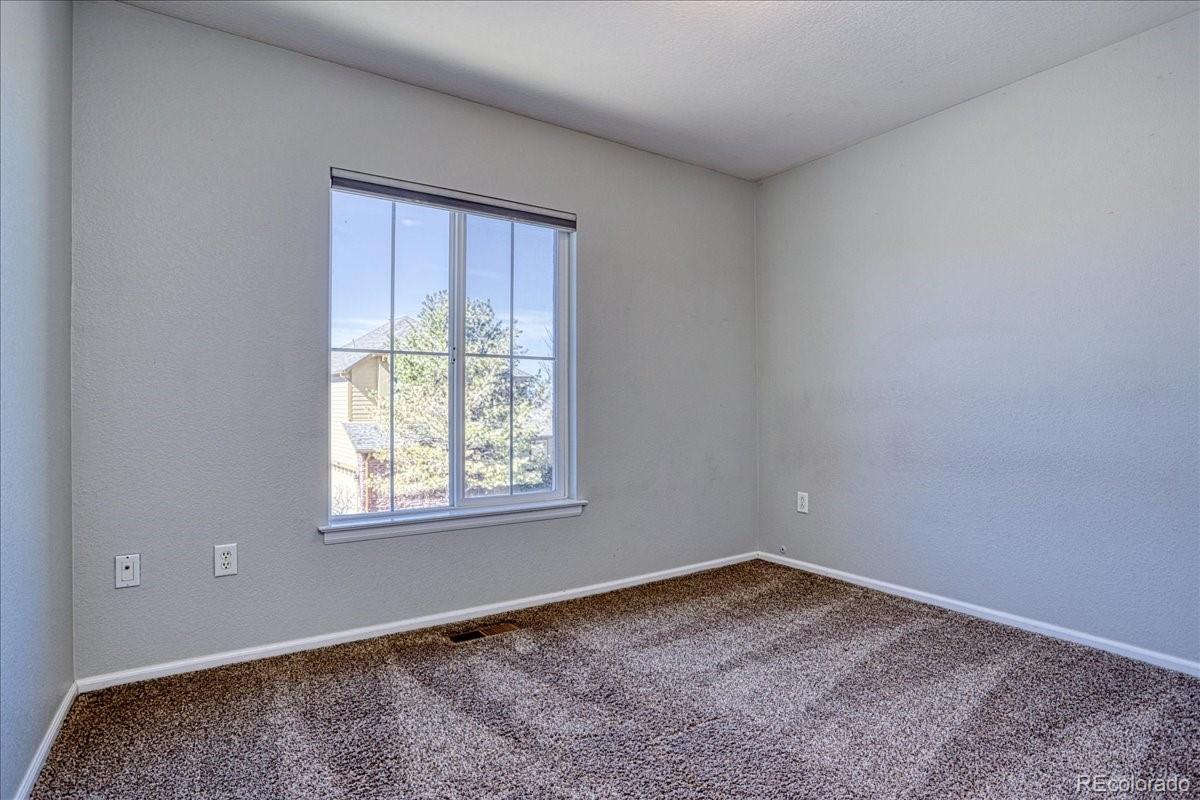 4005 Blue Pine Circle Highlands Ranch, CO 80126 - Photo 20 of 27 an empty room with a window