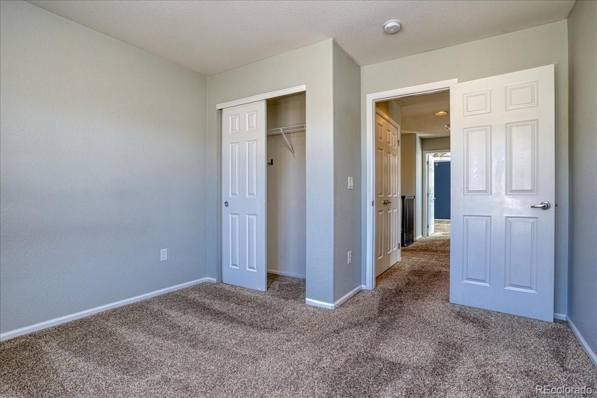 4005 Blue Pine Circle Highlands Ranch, CO 80126 - Photo 21 of 27 an empty room with closet and a bathroom