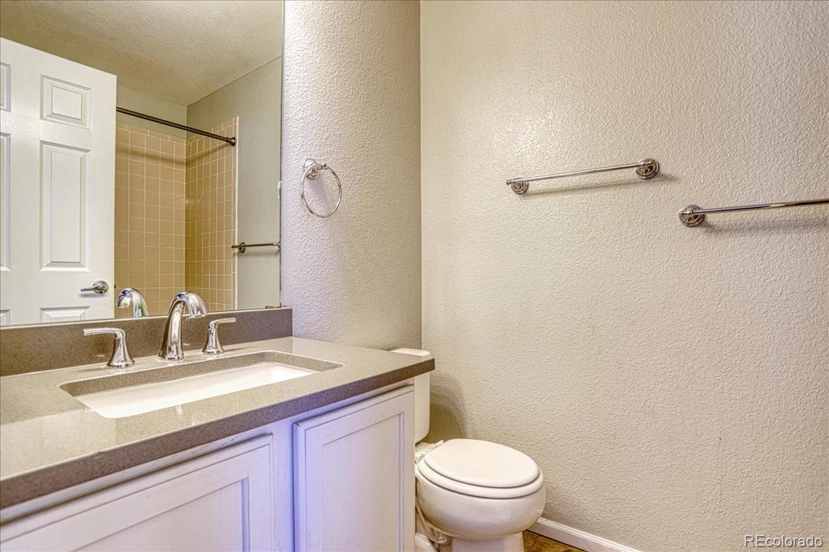 4005 Blue Pine Circle Highlands Ranch, CO 80126 - Photo 24 of 27 a bathroom with a sink toilet and vanity