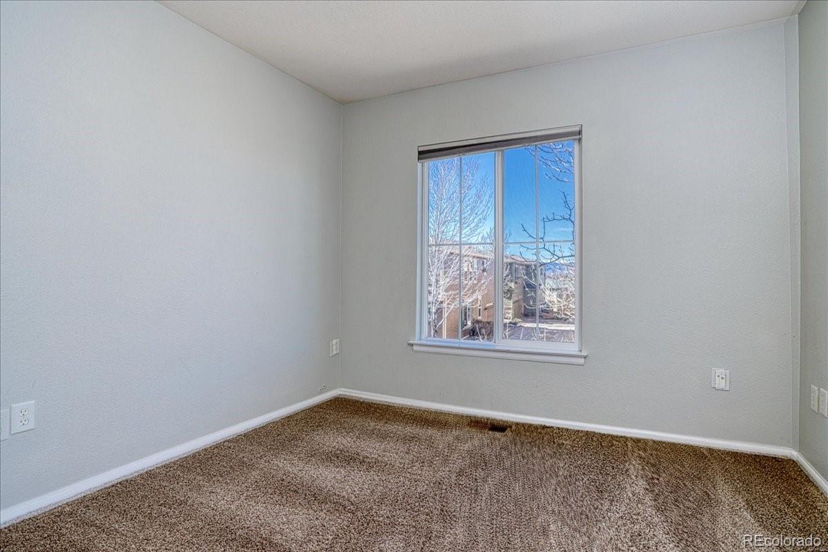4005 Blue Pine Circle Highlands Ranch, CO 80126 - Photo 25 of 27 an empty room with windows