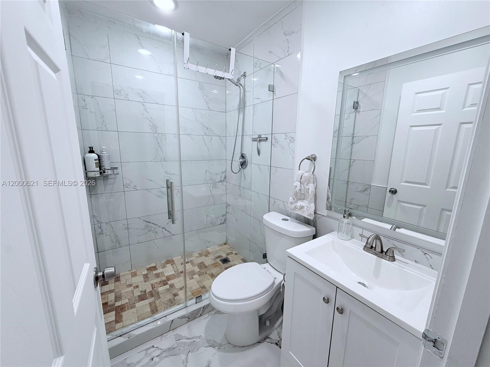 11020 Southwest 42nd Terrace Miami, FL 33165 - Photo 12 of 22 a bathroom with a sink toilet and shower