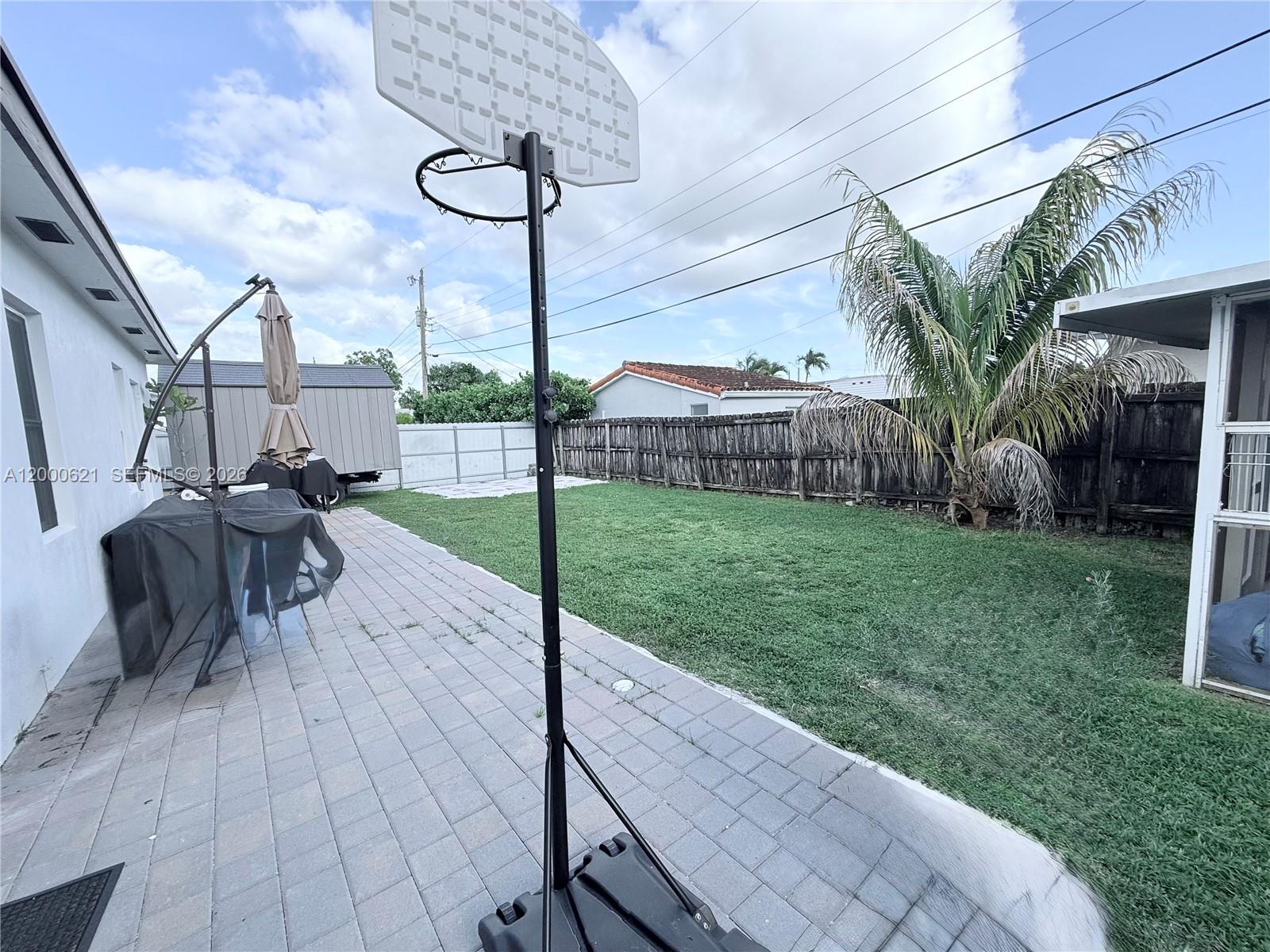 11020 Southwest 42nd Terrace Miami, FL 33165 - Photo 21 of 22 a view of yard with patio