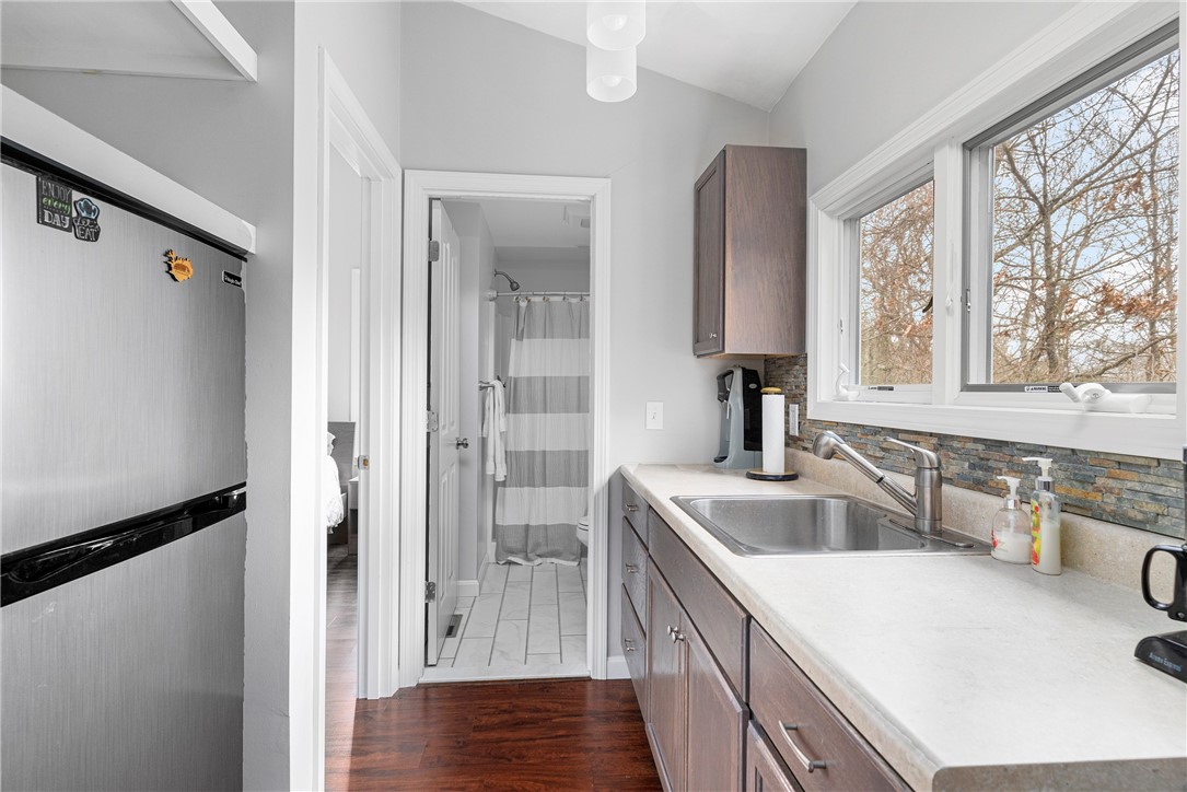 267 Widow Sweets Road Exeter, RI 02822 - Photo 32 of 46 Galley kitchenette with refrigerator, storage and sink.