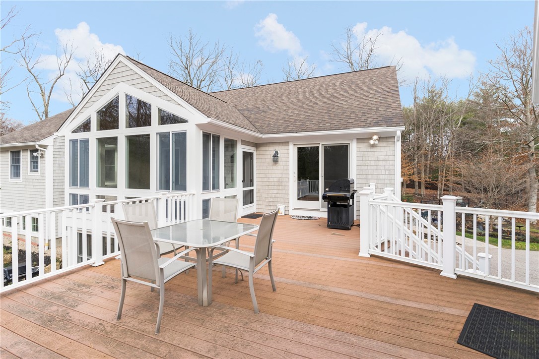 267 Widow Sweets Road Exeter, RI 02822 - Photo 38 of 46 Great outdoor space with a spacious deck that connects the 2 buildings. There is also a lower deck just a few steps down from this one.