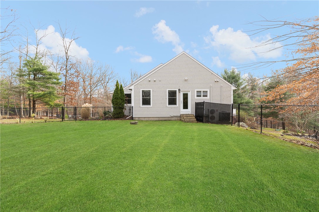 267 Widow Sweets Road Exeter, RI 02822 - Photo 42 of 46 Side yard looking toward the Master bedroom with its own door to the yard