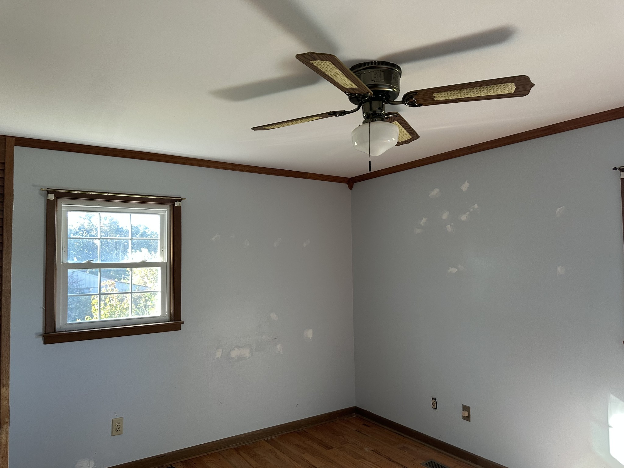 56 Gum Springs Road Lawrenceburg, TN 38464 - Photo 7 of 18 an empty room with wooden floor fan and windows