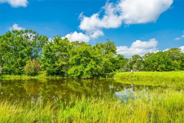 a view of a lake with a big yard