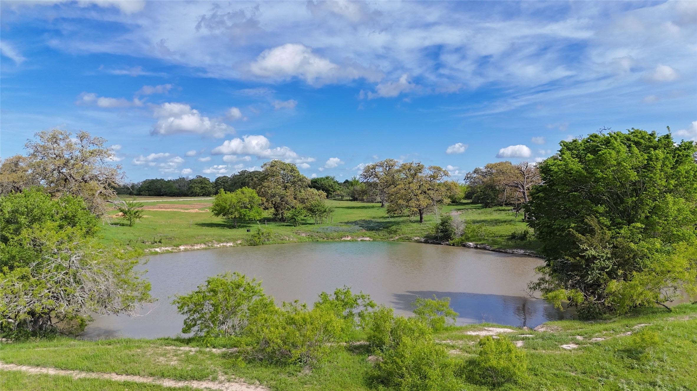 0 FM 180 Road Ledbetter, TX 78946 - Photo 11 of 14 a view of a lake with a yard