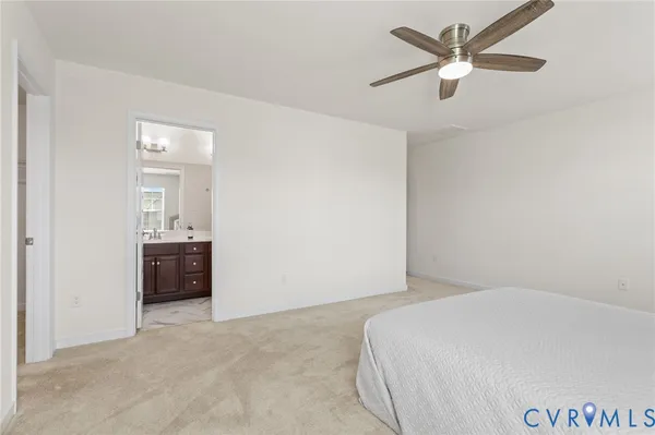 an empty room with closet and windows