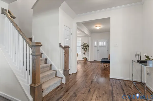 a view of entryway with wooden floor