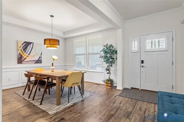 a view of a dining room with furniture and wooden floor