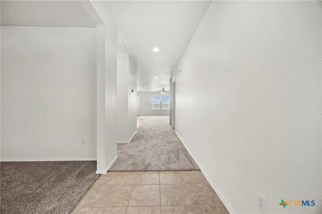 a view of a hallway with a white walls