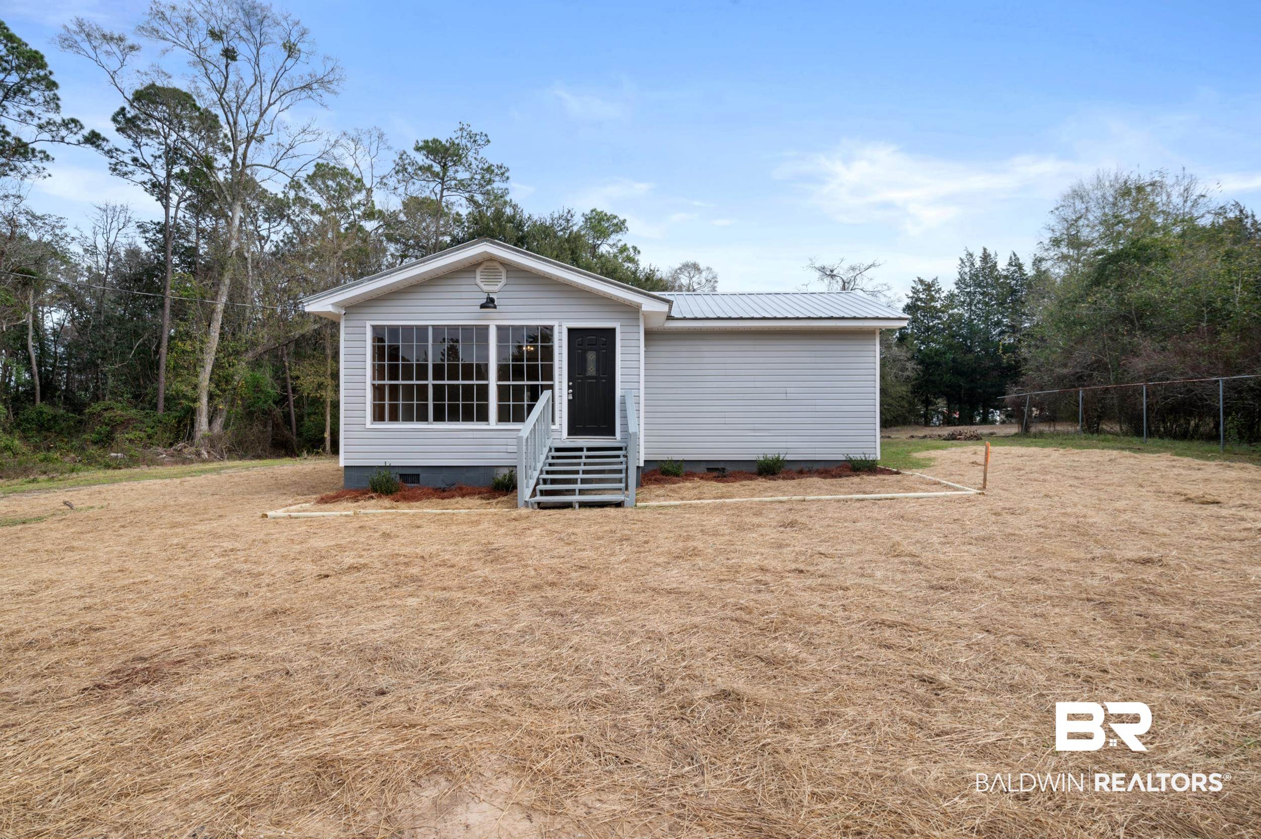 35780 Spring Road North Stapleton, AL 36578 - Photo 1 of 41 View of front facade featuring crawl space and a metal roof