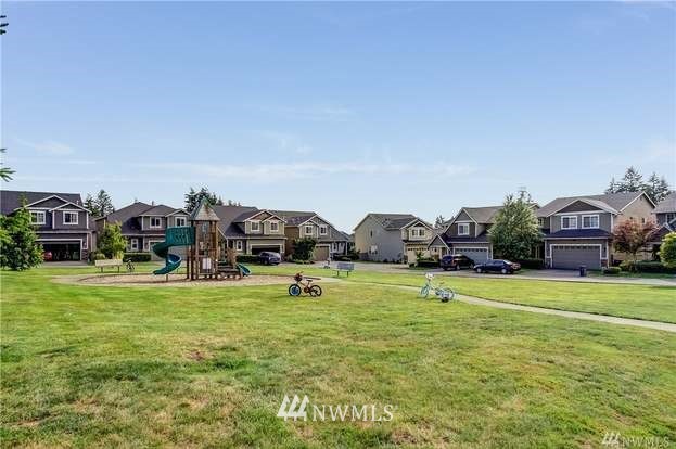 4326 226th Place Southeast Bothell, WA 98021 - Photo 3 of 37 a house with a big yard and large trees