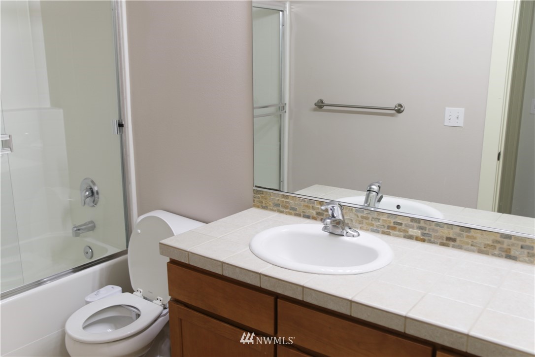 4326 226th Place Southeast Bothell, WA 98021 - Photo 22 of 37 a bathroom with a sink toilet and shower