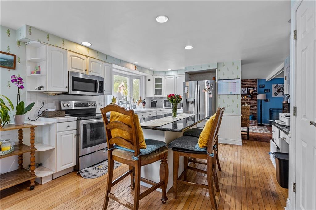 2116 Ramsey Road Monroeville, PA 15146 - Photo 12 of 28 a dining room with furniture and wooden floor