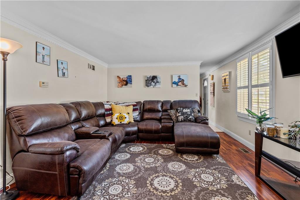 2116 Ramsey Road Monroeville, PA 15146 - Photo 16 of 28 a living room with furniture and a flat screen tv