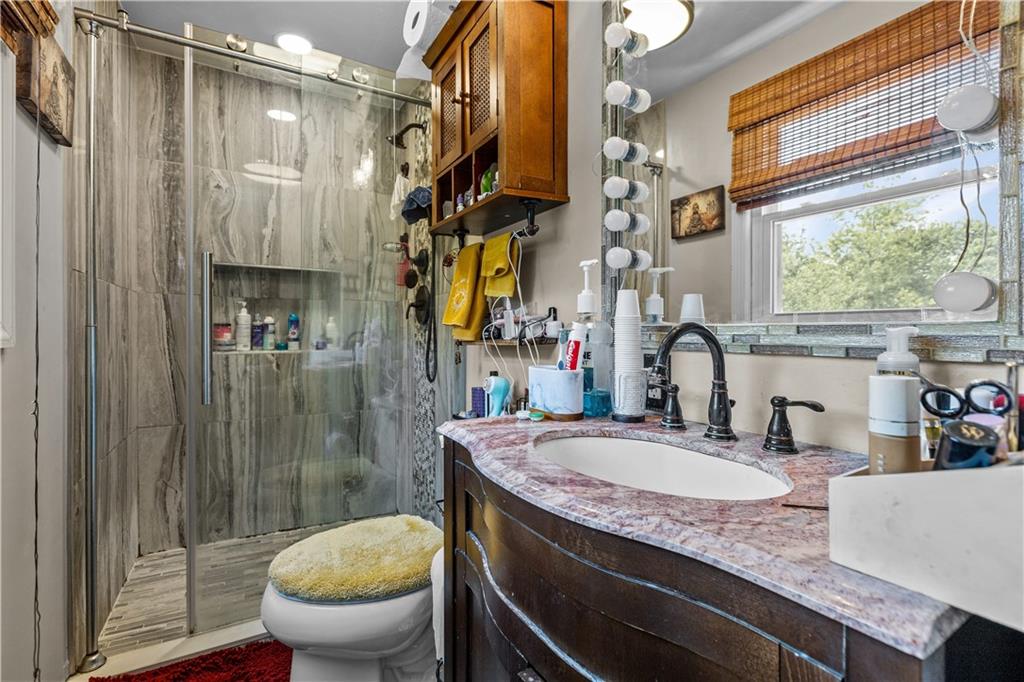 2116 Ramsey Road Monroeville, PA 15146 - Photo 19 of 28 a bathroom with a granite countertop sink toilet and shower