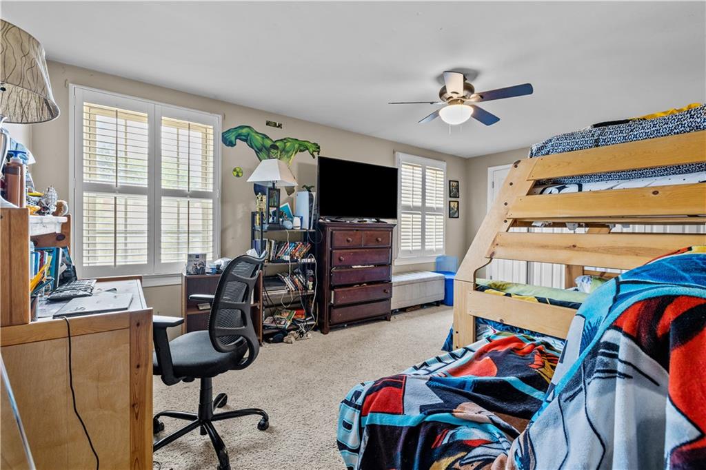 2116 Ramsey Road Monroeville, PA 15146 - Photo 20 of 28 a bedroom with furniture a ceiling fan and a window