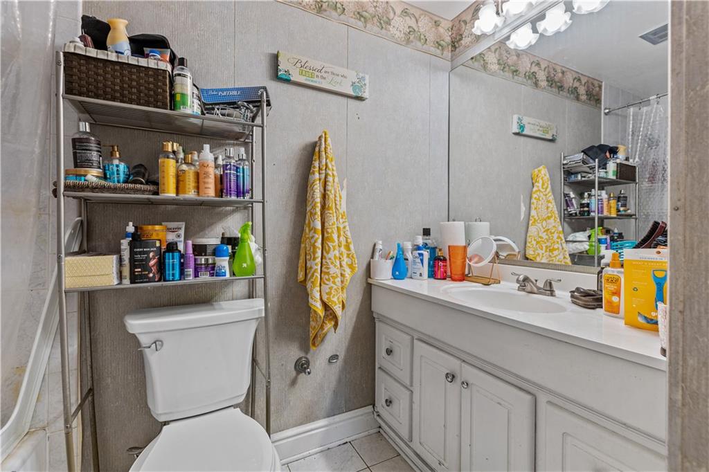 2116 Ramsey Road Monroeville, PA 15146 - Photo 23 of 28 a bathroom with a sink a toilet and a mirror