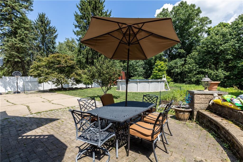 2116 Ramsey Road Monroeville, PA 15146 - Photo 27 of 28 an outdoor space with furniture and umbrella