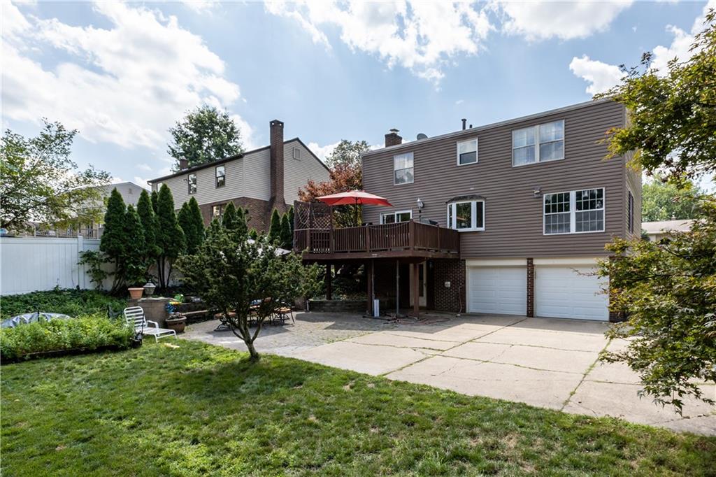 2116 Ramsey Road Monroeville, PA 15146 - Photo 28 of 28 a front view of a house with a garden and plants