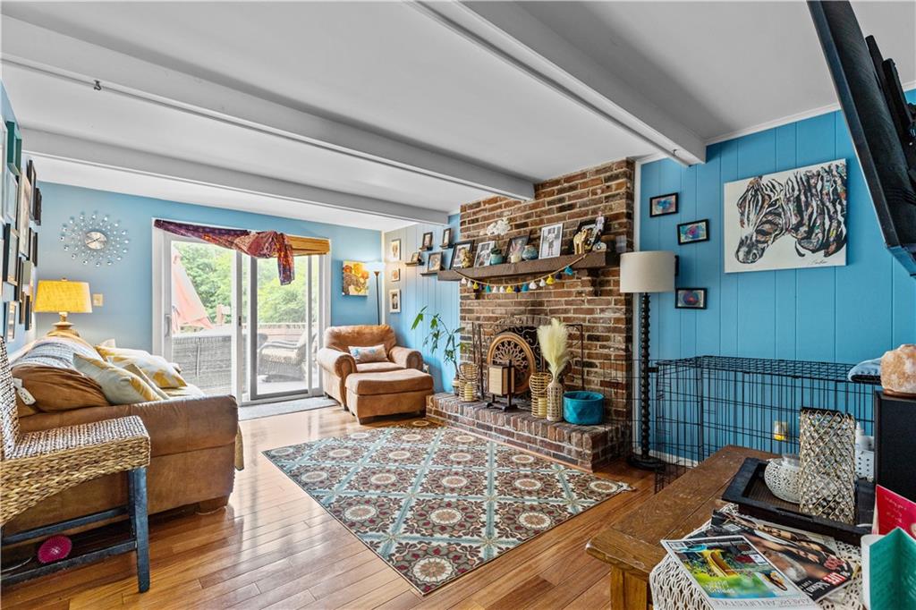 2116 Ramsey Road Monroeville, PA 15146 - Photo 5 of 28 a living room with furniture and a fireplace