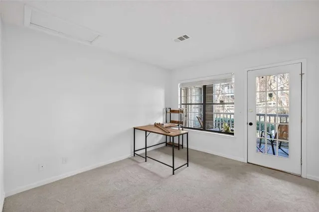 a work room with furniture and windows