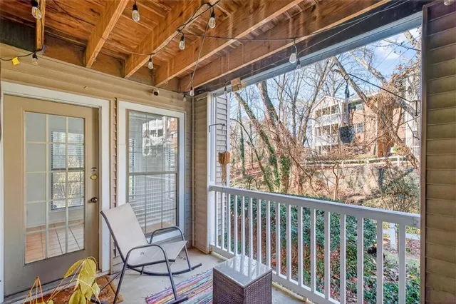 a view of a two chairs in the balcony